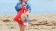 paradise-cove-little-girl-big-bag-of-kettle-cornr