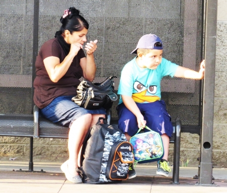 mother-and-son at bus stop